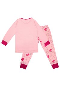 Pink cotton pajama set featuring a long-sleeve top with a solid color and matching pants with a star and paw print pattern. Pink cuffs.