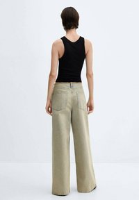 Mango MAYA - Flared Jeans - stone blue denim