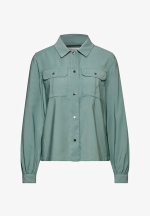Light green button-up shirt with a collared neck, two chest pockets, and elasticized cuffs. Made from smooth fabric with a subtle sheen.