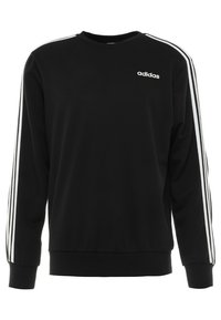 Sweatshirt noir en tissu doux, avec des manches longues, un col rond, et des accents blancs à trois rayures le long des manches. Logo sur la poitrine.