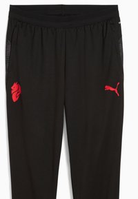 Pantaloni sportivi neri realizzati in un tessuto traspirante, con vita elastica e dettagli del logo rosso. Tasche laterali con rivestimento in rete.