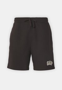 Černé bavlněné šortky s elastickým pasem a šňůrkou na stažení. Mají boční kapsy a bílé vyšívané logo "GAP" na levé noze.