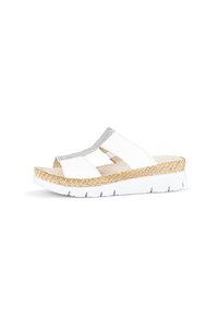 White slide sandal with a textured upper, silver accent strip, and woven pattern on a light brown, platform sole. Lightweight design.