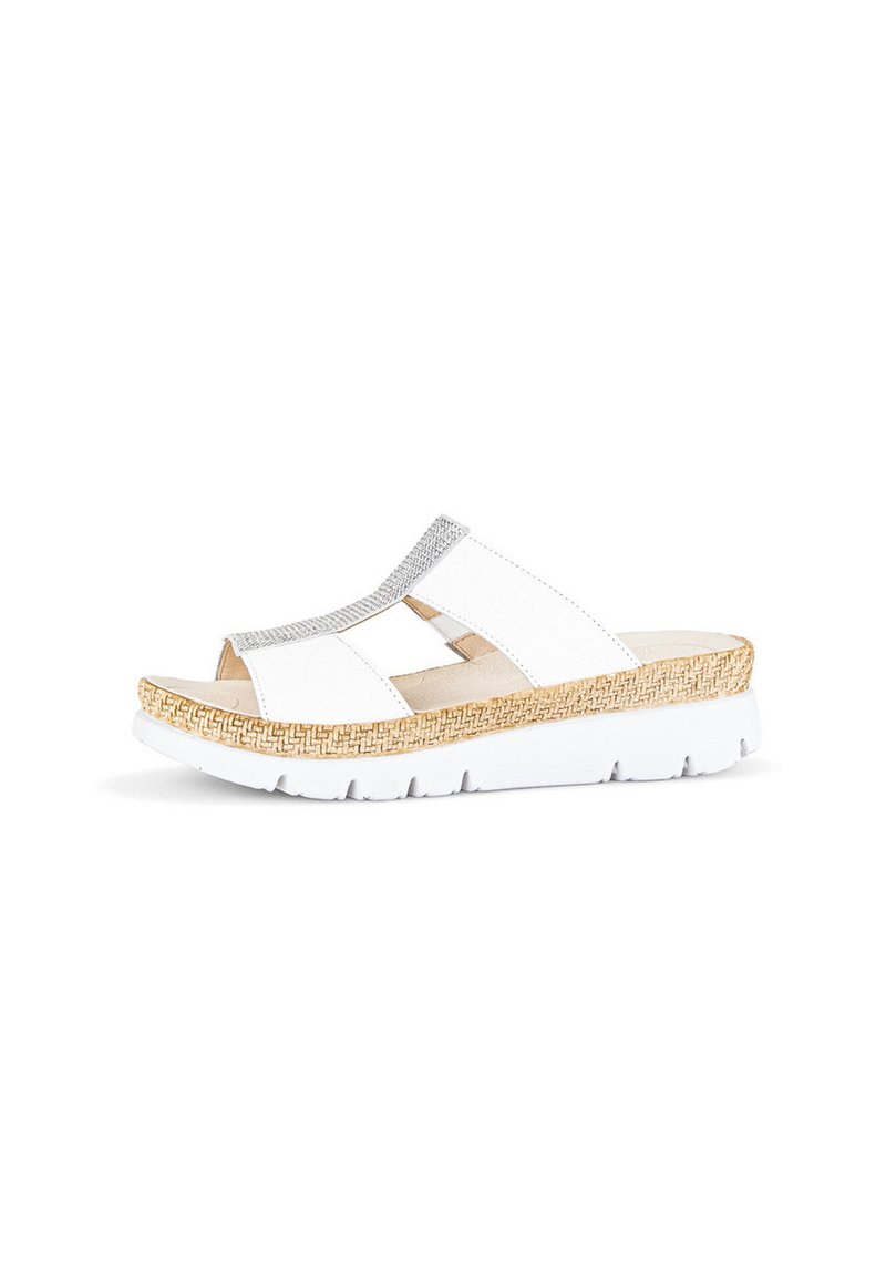 White slide sandal with a textured upper, silver accent strip, and woven pattern on a light brown, platform sole. Lightweight design.