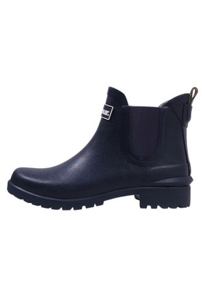 Navy blue waterproof ankle boot with elastic side panels, textured rubber sole, and a pull tab at the back for easy wear.