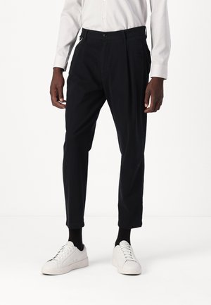 DEVYN - Trousers - black