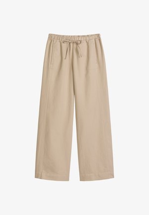 Beige wide-leg pants with elastic waistband and drawstring, featuring side pockets and a relaxed fit.