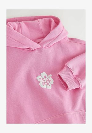 Rosa hoodie av mjukt tyg med vit hibiskusblomma broderad på framsidan. Långa ärmar med ribbade muddar.