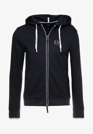 Schwarzer Kapuzenpullover mit Reißverschluss, weißen Kordeln und kleinem rundem Armani Exchange-Logo auf der linken Brust.
