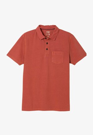 Lyhythihainen polotrikaatti polttavan oranssina, jossa kaulus, kolme mustaa nappia ja yksi rintatasku.