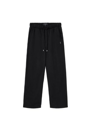 Czarne spodnie dresowe wykonane z miękkiego materiału, z elastycznym paskiem w talii i sznurkiem, bocznymi kieszeniami oraz małym detalem z logo.