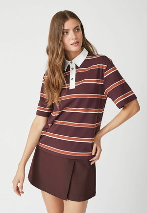 Maroon striped polo shirt with white collar and buttons, short sleeves, paired with a matching brown skort, smooth texture.