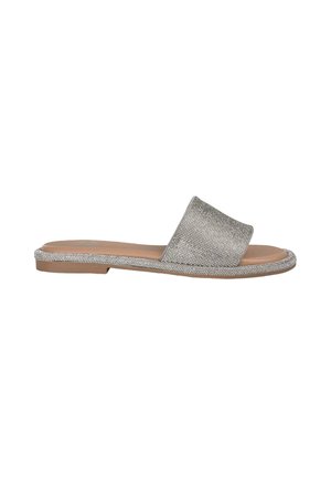 Silver slip-on sandal with a textured upper, flat brown sole, and decorative trim along the edge. Simple, open-toed design.