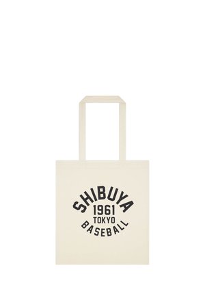 Płócienna torba z czarnym napisem Shibuya 1961 Tokyo Baseball na kremowym tle.