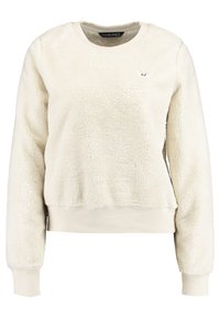 Kremowy, puszysty sweatshirt o teksturowanej powierzchni. Posiada długie rękawy, okrągły dekolt oraz ribbowany dół. Mały, wyszywany znak z przodu.