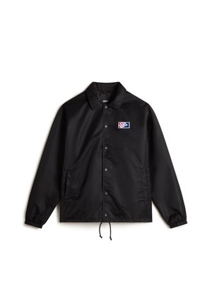 Giacca nera in nylon con chiusura a bottoni a pressione, orlo regolabile con coulisse e tasche laterali. Presenta una patch colorata con il logo sul petto.