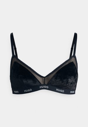 Black bra with a velvet texture, mesh panels, and scalloped edges. Features a logo band with "HUGO" in contrasting white.