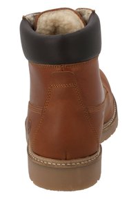 Bruine leren enkellaars met een zwart gewatteerd kraagje, witte stiksels en een gestructureerde rubberen zool. Gevoerd interieur voor extra warmte.