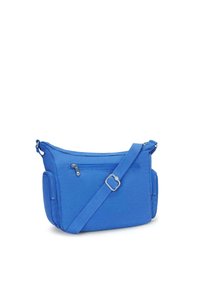 Blue crossbody bag made of fabric with a smooth texture. Features a zippered main compartment and adjustable strap for convenience.