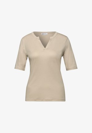 Beige dames top met korte mouwen, een V-vormige inkeping bij de halslijn en een aansluitend model, gemaakt van zachte, lichtgewicht stof.