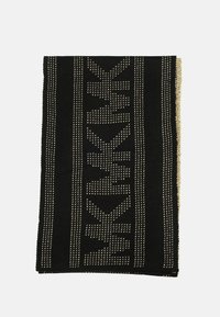 Coperta nera con un motivo testurizzato di piccoli triangoli bianchi e righe orizzontali, con un bordo dorato. Tessuto morbido e lavorato. 