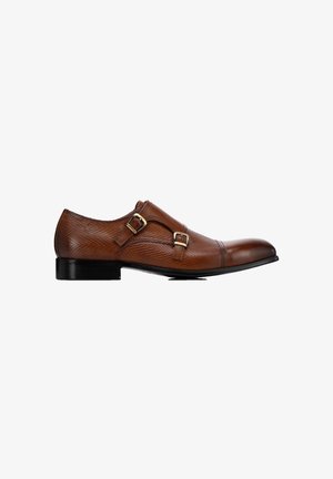 Brown leather dress shoe with a textured surface, double buckle accents, and a pointed toe design. Features a low black heel.