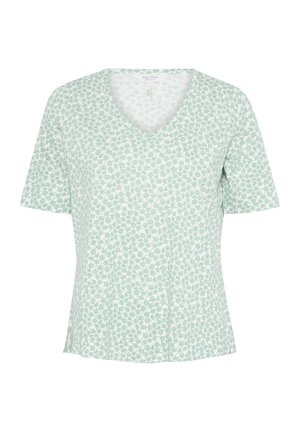 Cămașă cu mânecă scurtă și guler în V, de culoare verde deschis, cu un imprimeu floral. Fabricată dintr-un material moale, având o croială lejeră și slituri laterale la tiv.