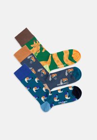 Drei Paar Socken mit bunten Tiermustern. Die Materialien sind weiche Baumwollmischungen in lebendigen Farben wie Grün, Blau und Orange.
