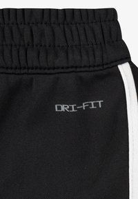 Nike Sportswear CLUB PROPUS UNISEX SET - Pantaloni de trening - black