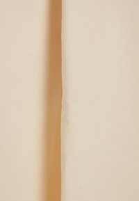 Light beige fabric with a smooth texture, displaying a clean, even weave. The edges appear neatly finished with no visible patterns or accents.