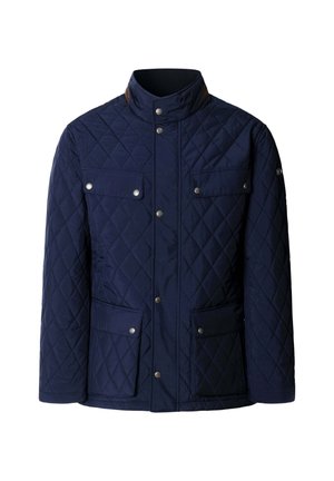 Námornícky prešívaný kabát s vysokým golierom, dvoma prsnými vreckami s klopou a zaisťovaním na patent, a dvoma veľkými dolnými vreckami.