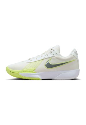 White athletic shoe with a textured upper, featuring a lime green outsole and accents, and a gray Nike logo on the side.