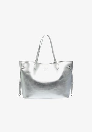 Silver tote bag made of glossy metallic material. Features two long handles, drawstring accents, and a centered logo on the front.