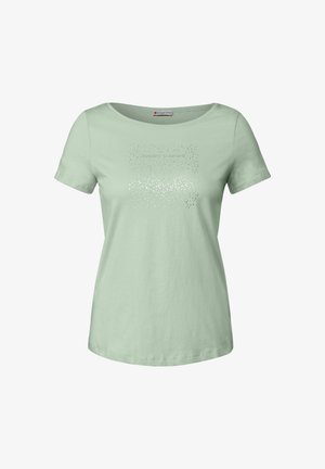 T-shirt en coton vert clair avec des manches courtes et un col en U. Présente un design imprimé texturé avec la phrase "inspire-toi."