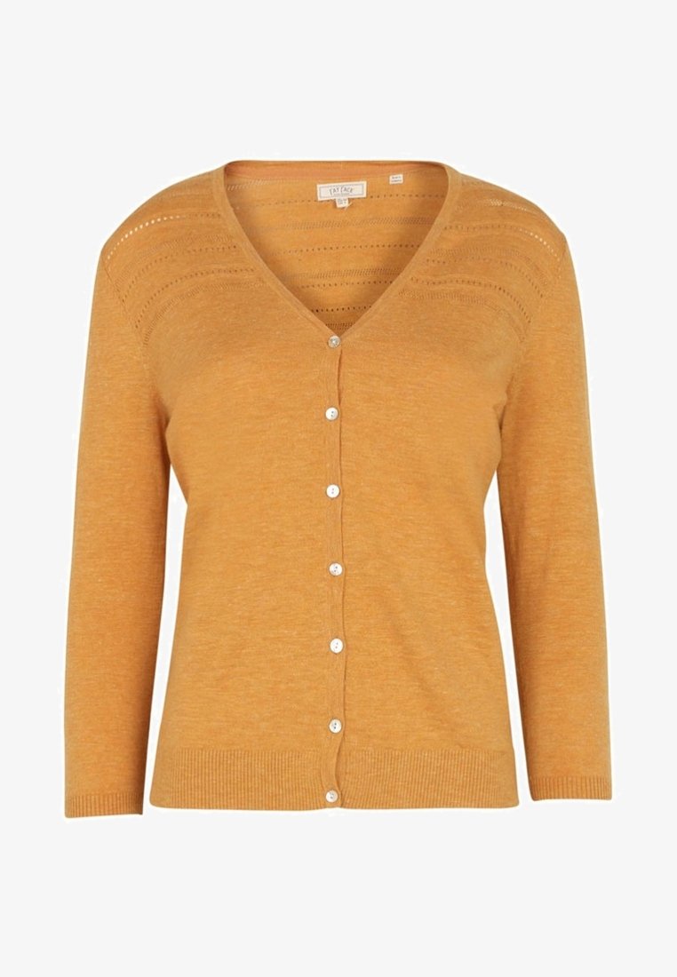 Mustard yellow cardigan with a v-neck, long sleeves, and white button closure. Textured stitch detailing across the shoulders.