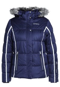 Veste d'hiver matelassée bleu marine avec passepoil blanc, capuche amovible en fausse fourrure, fermeture éclair devant et poches zippées devant et sur la manche.
