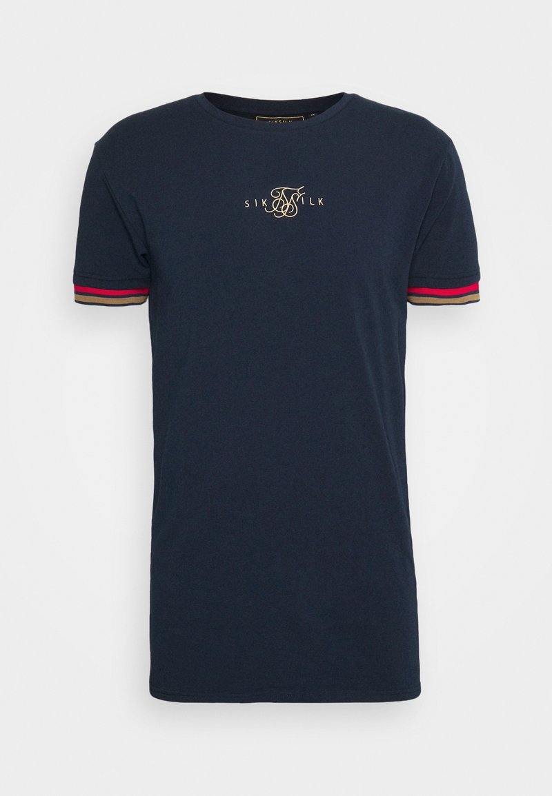 T-shirt bleu marine en coton, avec des manches courtes ornées de rayures rouges, beiges et noires, et un détail de logo doré sur la poitrine.