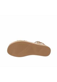 Sandali beige con suola in gomma texturizzata, cinturino regolabile e un motivo sottile sulla soletta. Leggeri e progettati per il comfort.
