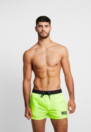 SANDY - Swimming shorts - black/yellow