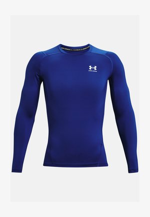 Pikkade varrukatega sportlik särk helesinisest kangast, millel on ümar kaelus, tihe istuvus ja valge logo rinnanahal. Sile tekstuur.