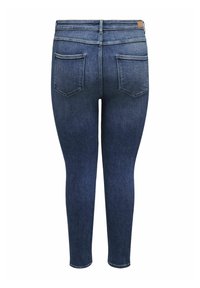 Jeans ajustados de mezclilla azul oscuro, con una cintura alta, cuatro bolsillos y una textura suave con un diseño desgastado en la parte trasera.