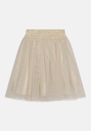 Tüllrock in hellbeige mit einem glänzenden elastischen Bund. Der Stoff ist durchscheinend und geschichtet für mehr Volumen, was eine weiche Textur und ein leichtes Erscheinungsbild verleiht.