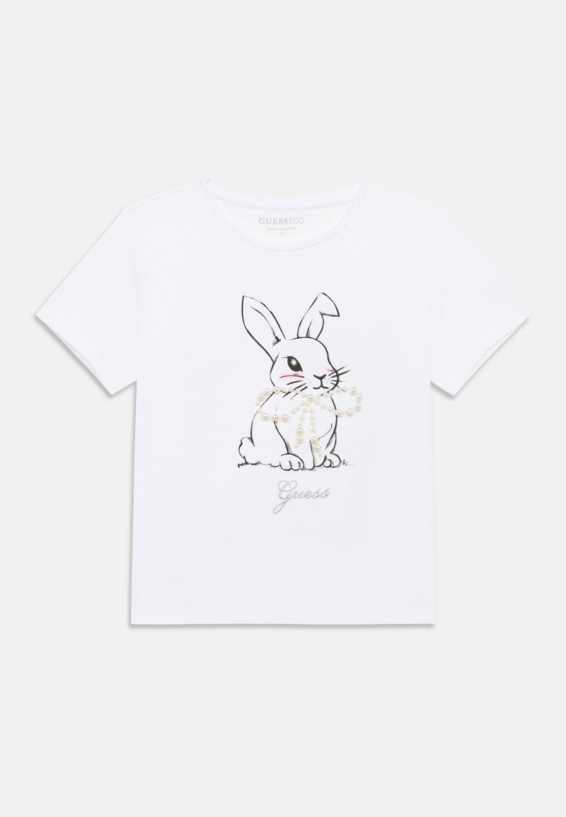Λευκό βαμβακερό μπλουζάκι με μαύρο περίγραμμα κουνελιού και διακοσμητικά μαργαριτάρια. Η λέξη "Guess" είναι τυπωμένη σε ασημί κάτω από το γραφικό. Κοντά μανίκια.