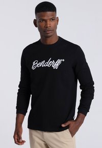 Black long-sleeve t-shirt featuring white embroidered "Bendorff" logo on the chest, made of smooth fabric with a ribbed texture.