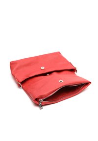 Red leather handbag with a smooth texture, fold-over design, magnetic snap closure, and a zippered compartment at the bottom.