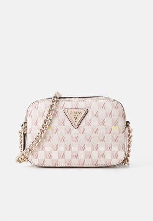 Beige and pink checkered Guess crossbody bag with gold chain strap and triangular logo plaque on the front.