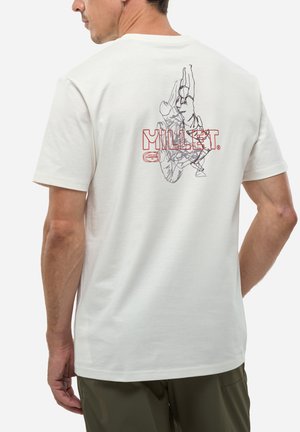 Man wearing white t-shirt with red "MILLET" text and line drawing of a rock climber on the back.