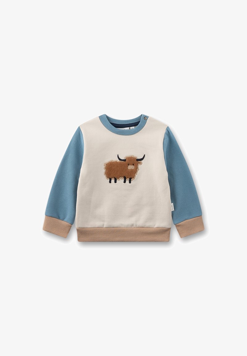Hellcremefarbener Pullover mit blauen Ärmeln und einem braun bestickten Tiermotiv. Strukturierte, gerippte Bündchen und Saum in Hellbraun. Knopfdetail an der Schulter.