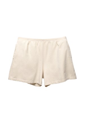 Cream-colored cotton shorts with an elastic waistband, two side pockets, and a relaxed fit. Smooth texture with a simple, unembellished design.