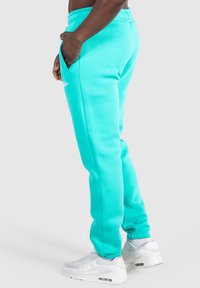 Smilodox CASUAL SLIM FIT KANE - Träningsbyxor - türkis